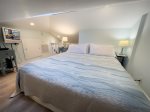 Loft bedroom with flatscreen tv